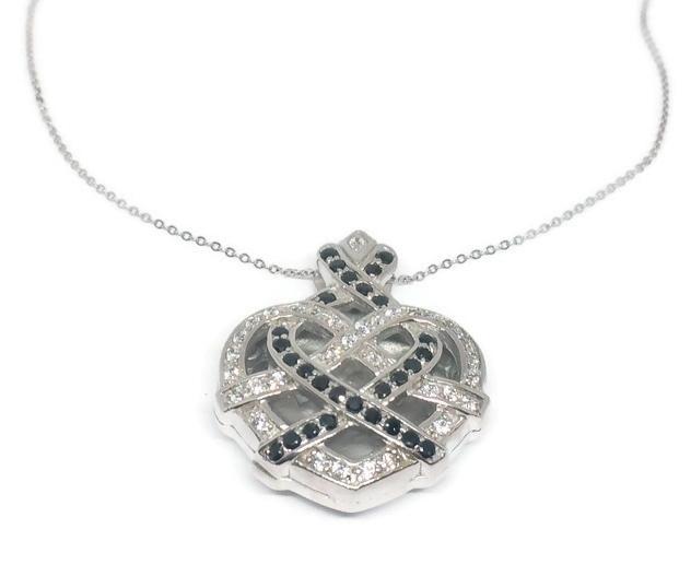 The DiamondVeneer Fashion Large Zirconite Cubic Zirconia 3-Dimensions Heart Pendant features a sterling silver necklace with a sparkling, intricately designed heart pendant adorned with white and black cubic zirconia stones.