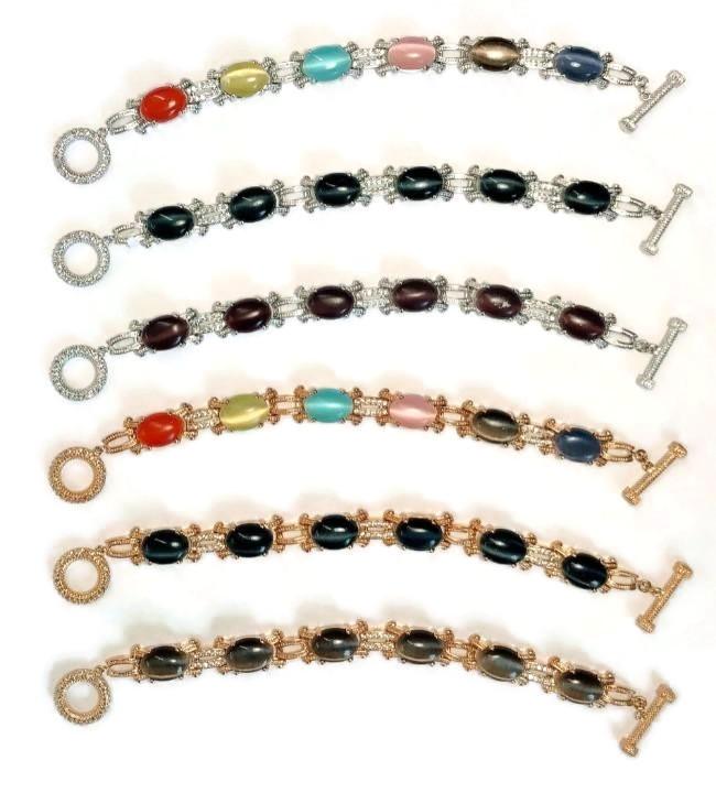 Five DiamondVeneer Fashion Cats Eye Oval Cabochon set w/Zirconite Cubic Zirconia Bracelet 501B097 pieces are arranged in parallel on a white background, each with metal links, toggle clasps, and one 18K Gold option.