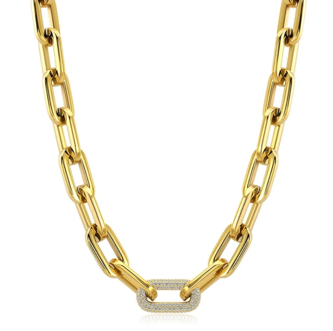 The Zirconmania Fashion Jewelry Unisex Paper Clip Link Chain Necklace (Zirconite 856N100) features large gold rectangular links and a thick center link adorned with clear cubic zirconia, shown on a plain white background.
