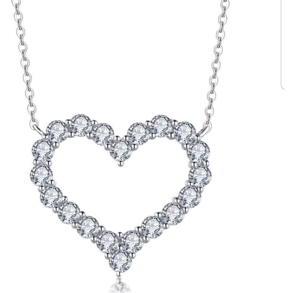The DiamondVeneer Fashion Classic Diamond Veneer Cubic Zirconia Heart Pendant (635P20285) is a rhodium-plated sterling silver necklace, outlined with sparkling cubic zirconia gemstones.