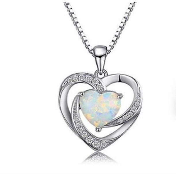 DiamondVeneer Fashions Lab Created Opal Heart Sterling Silver Pendant (714P0047) features a central opal heart, rhinestone accents, and a twisting silver design on a matching chain. Sales Special! Displayed against a white background.