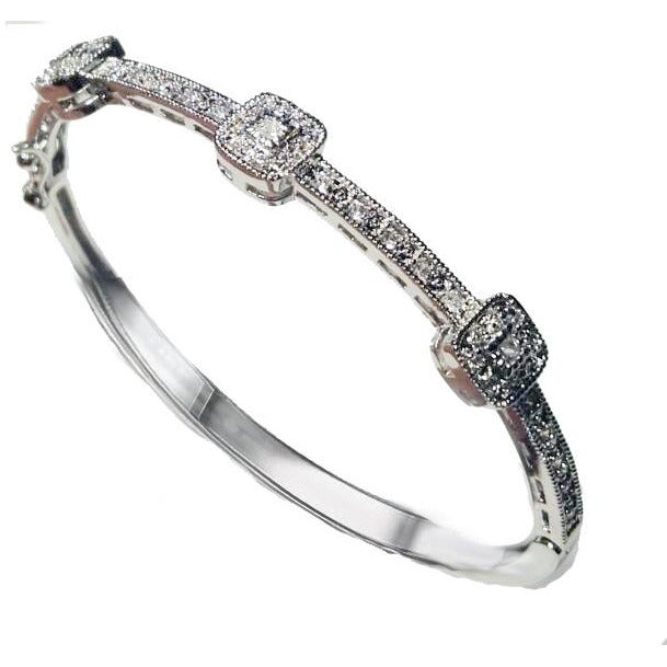 The DiamondVeneer Fashion Hinged Zirconite Cubic Zirconia 3-square Stations Rhodium Bangle Bracelet.698B004 features sparkling cubic zirconia clusters on a sleek rhodium band, showcased on a white background.