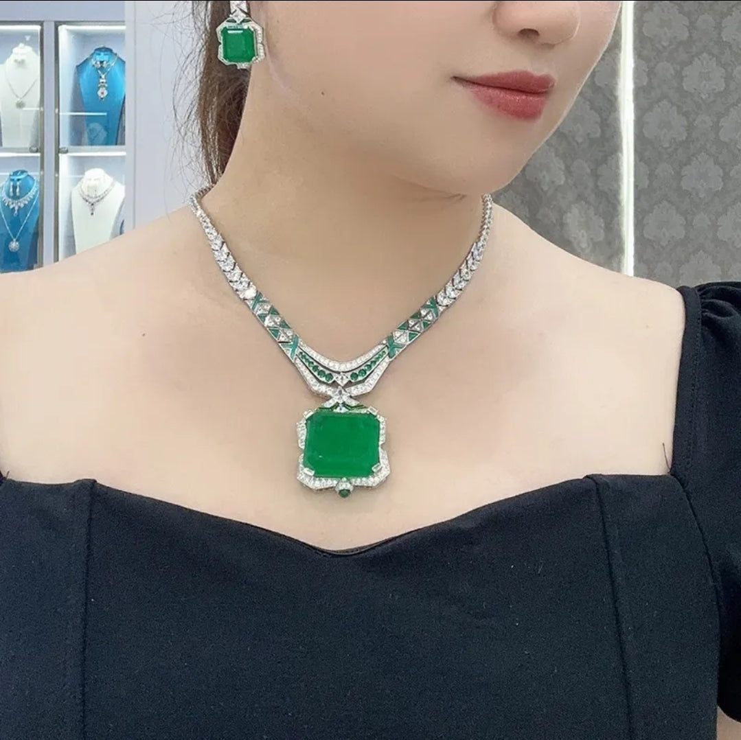 Emerald green zirconite necklace with square pendant and sparkling accents—bold, luxury jewelry statement piece.