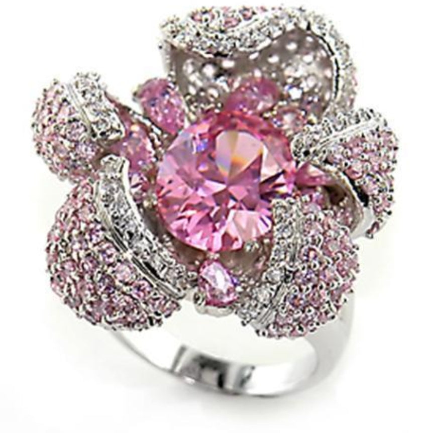 Sterling silver floral statement ring with pink gemstones and a large pink center, by Zirconmania Fashion Jewelry.