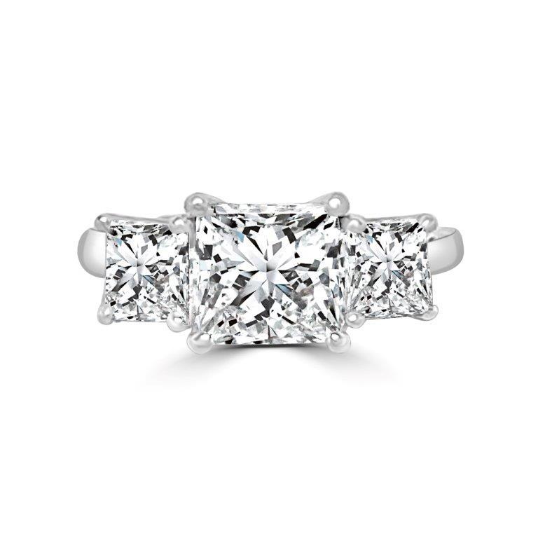 The DiamondVeneer Fashion Three Stone Square Diamond Veneer Cubic Zirconia 14K Gold Ring (635R009K) features a princess cut center stone and two side stones, all set in a sleek 14K white gold band.