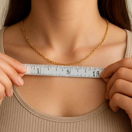 A woman measuring her collarbone with a soft measuring tape next to a stylish 18-inch chain, highlighting the importance of accurate measurement. Alt: Woman measuring collarbone with measuring tape and 18-inch chain.