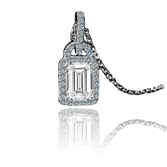 The DiamondVeneer Fashion 1CT Diamond Veneer Cubic Zirconia Pendant (635P25366) features a rectangular simulated diamond with a halo of smaller stones in sterling silver, elegantly showcased on a reflective white surface.