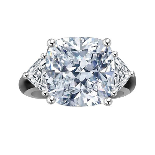 The DiamondVeneer Fashion 10CT Cushion Square Diamond Veneer Cubic Zirconia 14K Gold Ring (635R71199k) features a large cushion square center stone with two triangular side stones, all in a prong setting.