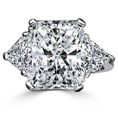The DiamondVeneer Fashion 10CT Diamond Veneer Cubic Zirconia Three Stone 14K Gold Ring showcases a radiant-cut center stone with two triangular side stones, echoing the brilliance of high-end designs.