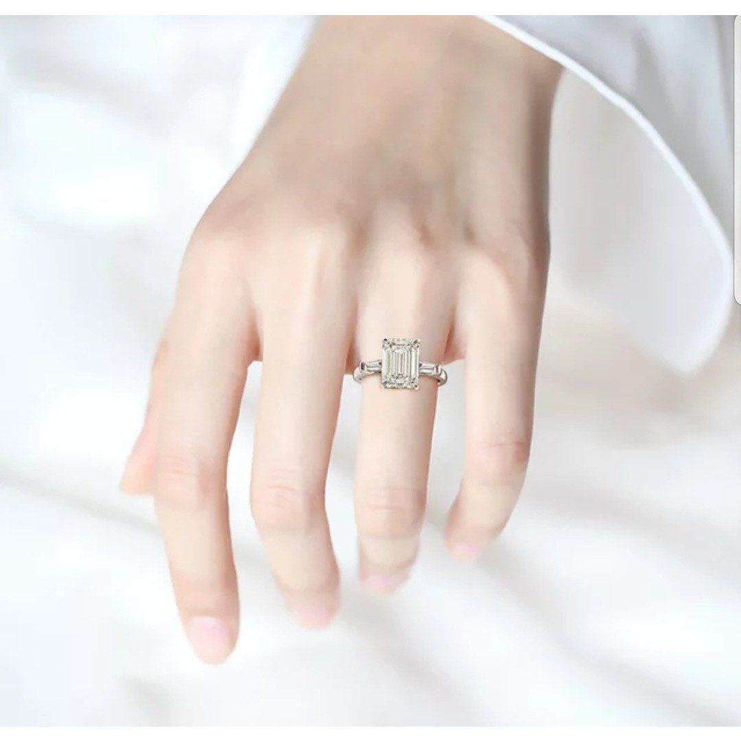 Emerald-cut cubic zirconia three-stone ring, sterling silver - front view