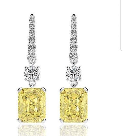 DiamondVeneer Fashion 10CT TW radiant Diamond Veneer Cubic Zirconia Drop Earrings (800E203) feature sterling silver, a large rectangular yellow stone, a round clear stone above, and a row of small clear stones on top.