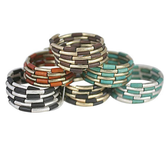 The DiamondVeneer Fashion Zirconite Natural Wood spiral cuff Bangle Bracelet (610B14072) features stacked, beaded rings in silver, gold, black, brown, orange, and turquoise with a unique brick-like pattern on a white background.