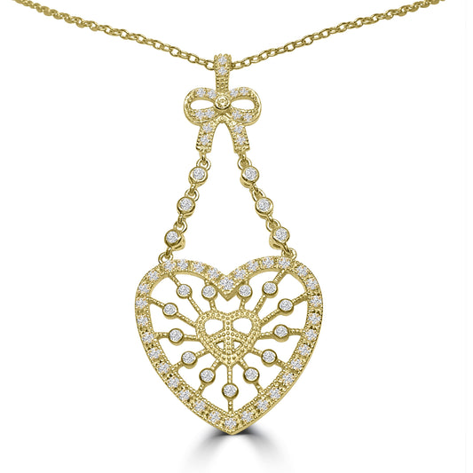 The DiamondVeneer Fashion Large Zirconite Cubic Zirconia Heart & Peace Pendant (STN218) features a sparkling heart-shaped pendant with intricate patterns and white stones, hanging from a bow detail also encrusted with stones.