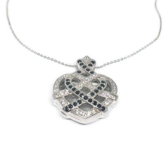 The DiamondVeneer Fashion Large Zirconite Cubic Zirconia 3-Dimensions Heart Pendant features a sterling silver necklace with a sparkling, intricately designed heart pendant adorned with white and black cubic zirconia stones.