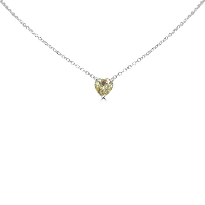 The DiamondVeneer Fashion 1CT Heart Diamond Veneer Cubic Zirconia Solitaire Pendant features a heart-shaped yellow cubic zirconia on a sterling silver chain, perfectly displayed against a white background.