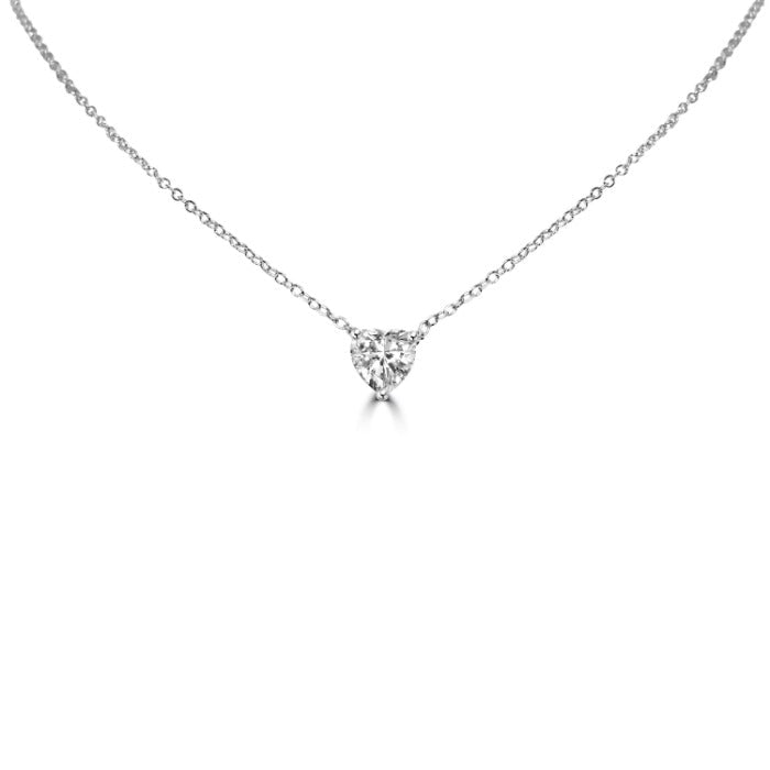 The DiamondVeneer Fashion 1CT Heart Diamond Veneer Cubic Zirconia Solitaire Pendant is a delicate sterling silver necklace with a heart-shaped cubic zirconia on a fine chain, shown on a plain white background.