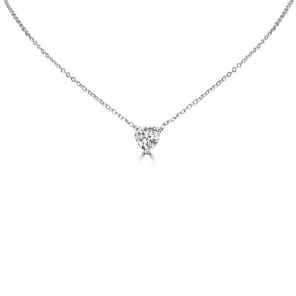 The DiamondVeneer Fashion 1CT Heart Diamond Veneer Cubic Zirconia Solitaire Pendant is a delicate sterling silver necklace with a heart-shaped cubic zirconia on a fine chain, shown on a plain white background.