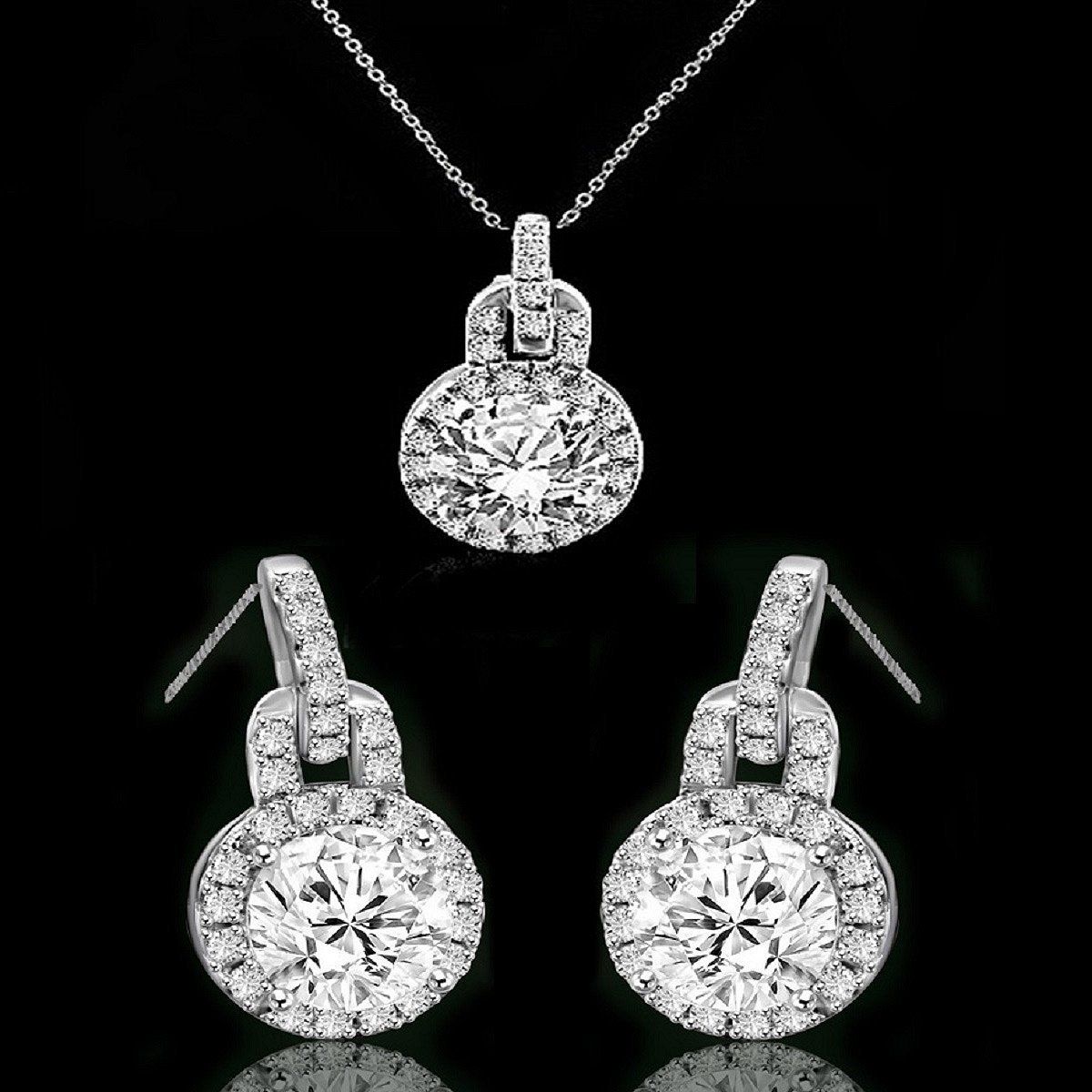 The DiamondVeneer Fashion Round Diamond Veneer Cubic Zirconia Sterling Silver Halo Pendant and Earrings Set (635P10732/635E3234) features a sparkling pendant necklace and matching earrings with center stones surrounded by halos.
