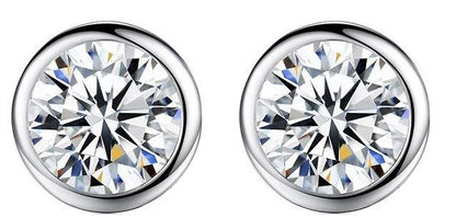 DiamondVeneer Fashions Round Zirconite Cubic Zirconia Sterling Silver Stud Earrings (EBZL) feature sparkling, bezel-set stones in shiny silver, shown against a white background.
