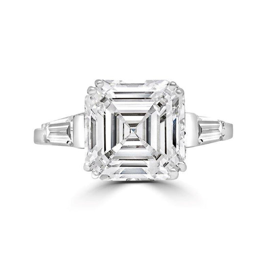 The DiamondVeneer Fashion 3CT Asscher cut Diamond Veneer Cubic Zirconia 14K Gold Ring (635R0011K) features a large square center stone with tapered baguette side stones, shown against a white background.