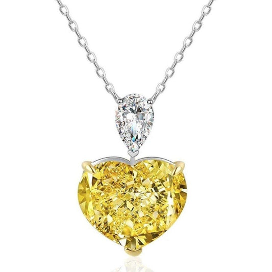 The DiamondVeneer Fashion 5CT Heart Diamond Veneer Cubic Zirconia Pendant (800P102) features a delicate sterling silver chain with a yellow heart-shaped pendant and a smaller pear-shaped cubic zirconia above it.