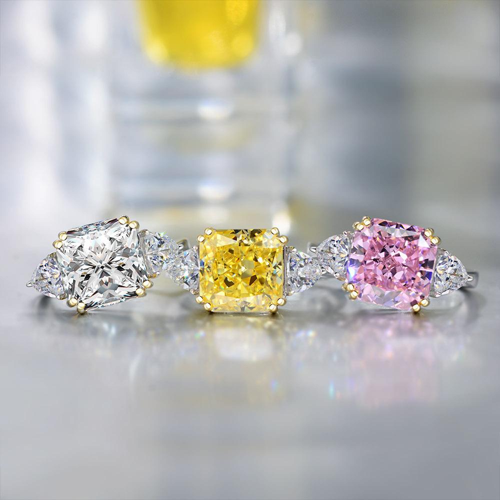 The Three Stones Square Cubic Zirconia Engagement Ring (801R9042) by DiamondVeneer Fashion features clear, yellow, and pink stones with smaller accents set in mixed metal bands, including sterling silver.
