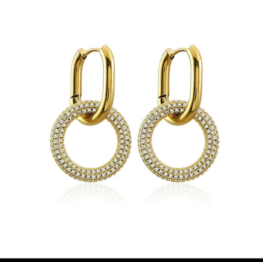 DiamondVeneer Fashion’s Stainless Steel Door Knocker Earrings (Zirconite 856E101) feature round, double-layered gold hoops with white zirconite gems—stylish, modern, and perfect for any occasion.