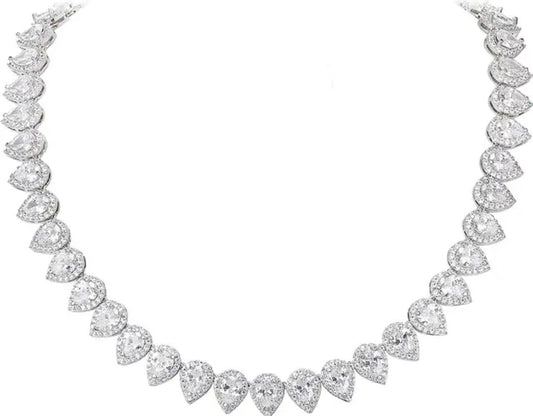 The Cubic Zirconia Statement Necklace Zirconite by Zirconmania Fashion Jewelry features sparkling, pear-shaped zirconia clusters set closely on an elegant, semicircular chain against a plain white background.
