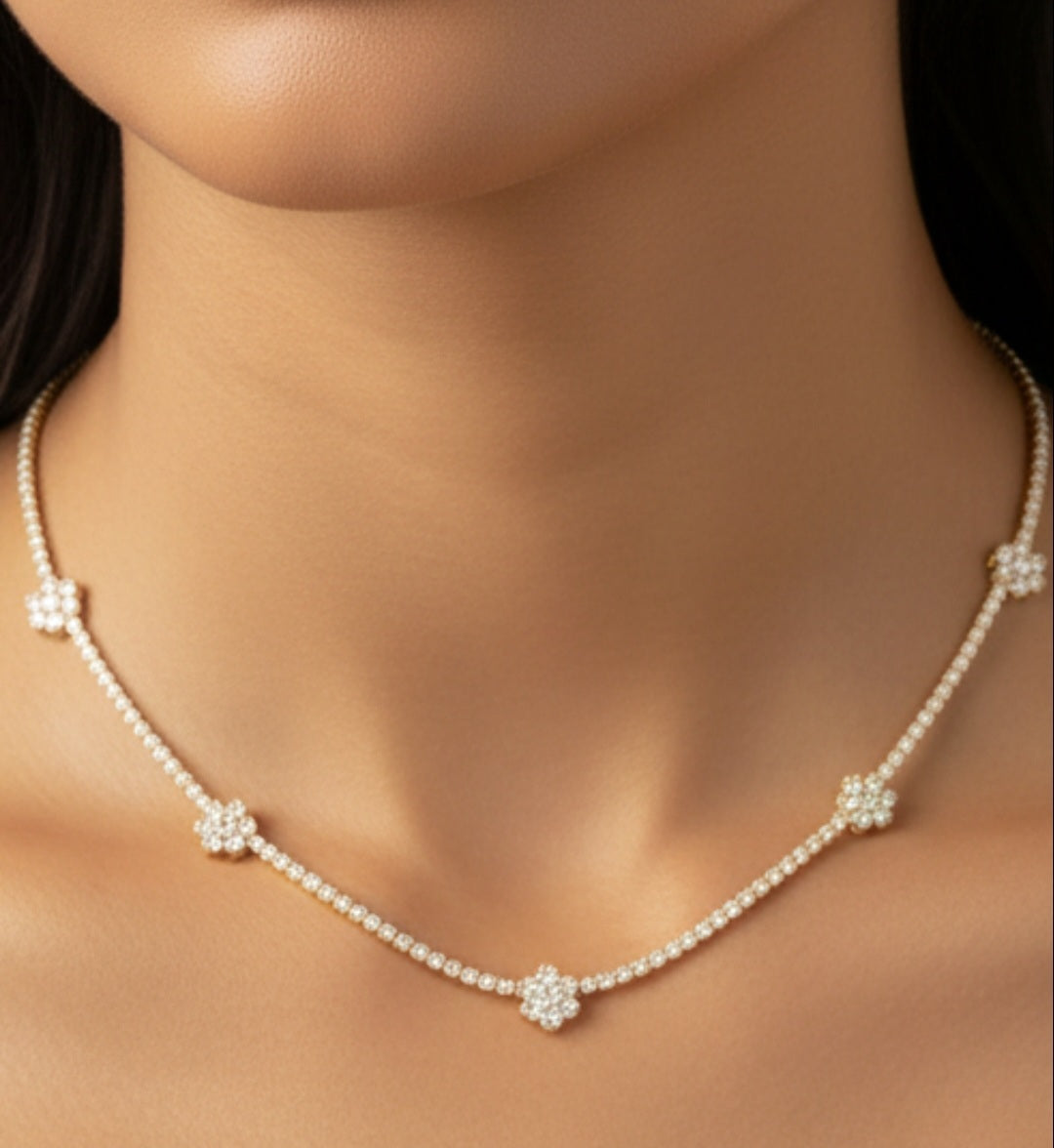 Woman wearing Zirconmania 925 silver necklace featuring cubic zirconia flower clusters—elegant design ideal for weddings or parties.