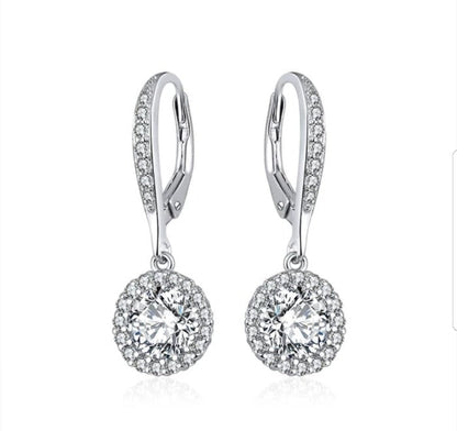 The DiamondVeneer Fashion Cubic Zirconia Earrings (635E10687) feature round center stones with a halo of smaller clear accents, set in sterling silver lever-backs for timeless elegance.