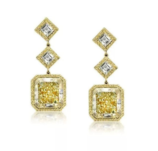The Radiant 18CT TW Square Diamond Veneer Cubic Zirconia Drop Earrings by DiamondVeneer Fashion feature two square stones—smaller clear above larger yellow—framed with gold and clear accents on each earring. Product code: 830E1030.