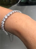 Cubic Zirconia Tennis Bracelet with safety chain. 698Bcast