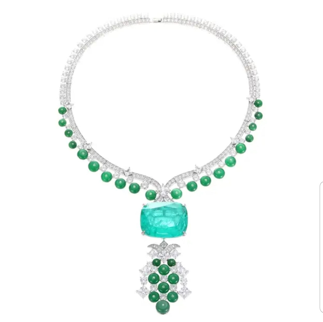 The DiamondVeneer Fashion Fusion Colombian Emerald Cubic Zirconia Necklace 840N105E showcases round green gems, a central rectangular emerald, and a pendant with green and white stones in an elegant, symmetrical design.
