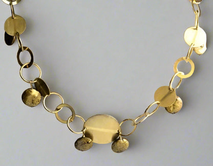 The DiamondVeneer Fashion O links Gold Coin Pearls Necklace (STN230) features handcrafted round, flat, and textured discs linked by circular chain links, arranged in a semi-circle. Final Sale.