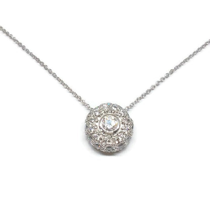 The DiamondVeneer Fashion Donut Diamond Veneer Cubic Zirconia Pendant (.635P21025) is a sterling silver necklace with a donut-shaped pendant adorned with sparkling stones and a central gemstone, shown against a white background.