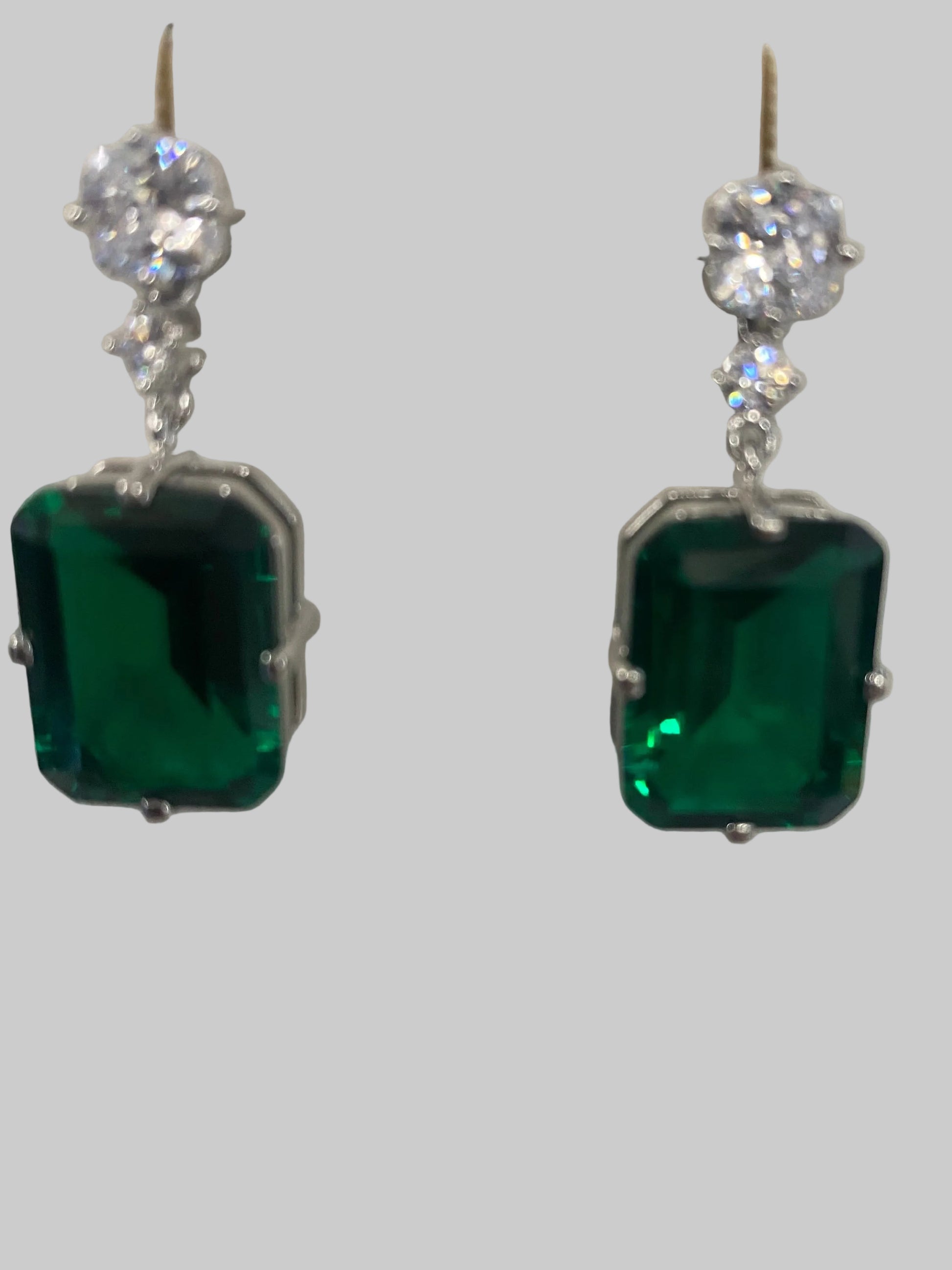 DiamondVeneer drop earrings, style 830E1033, feature elegant cubic zirconia in a modern design on a white display stand.