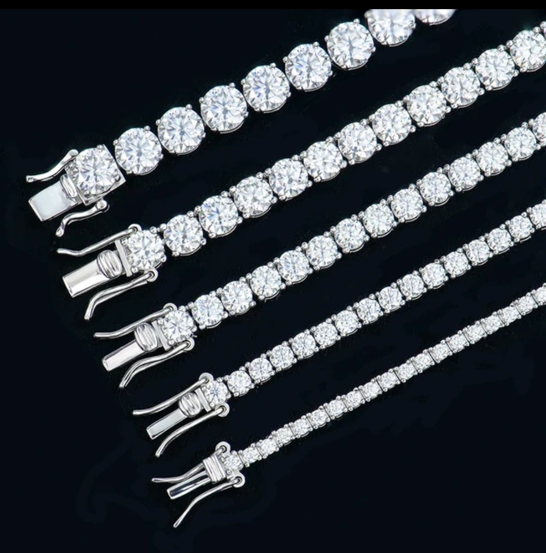 Five DiamondVeneer Fashion sterling silver tennis bracelets with varying diamond sizes and sparkling clasps are displayed in parallel on black, featuring the Moissanite Lab Created Diamond Tennis Bracelet 850B for extra brilliance.