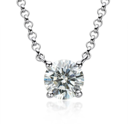 A close-up of the DiamondVeneer Fashion Round Cubic Solitaire Pendant (635P100M), a sterling silver necklace with a single round-cut simulated diamond held by four prongs.