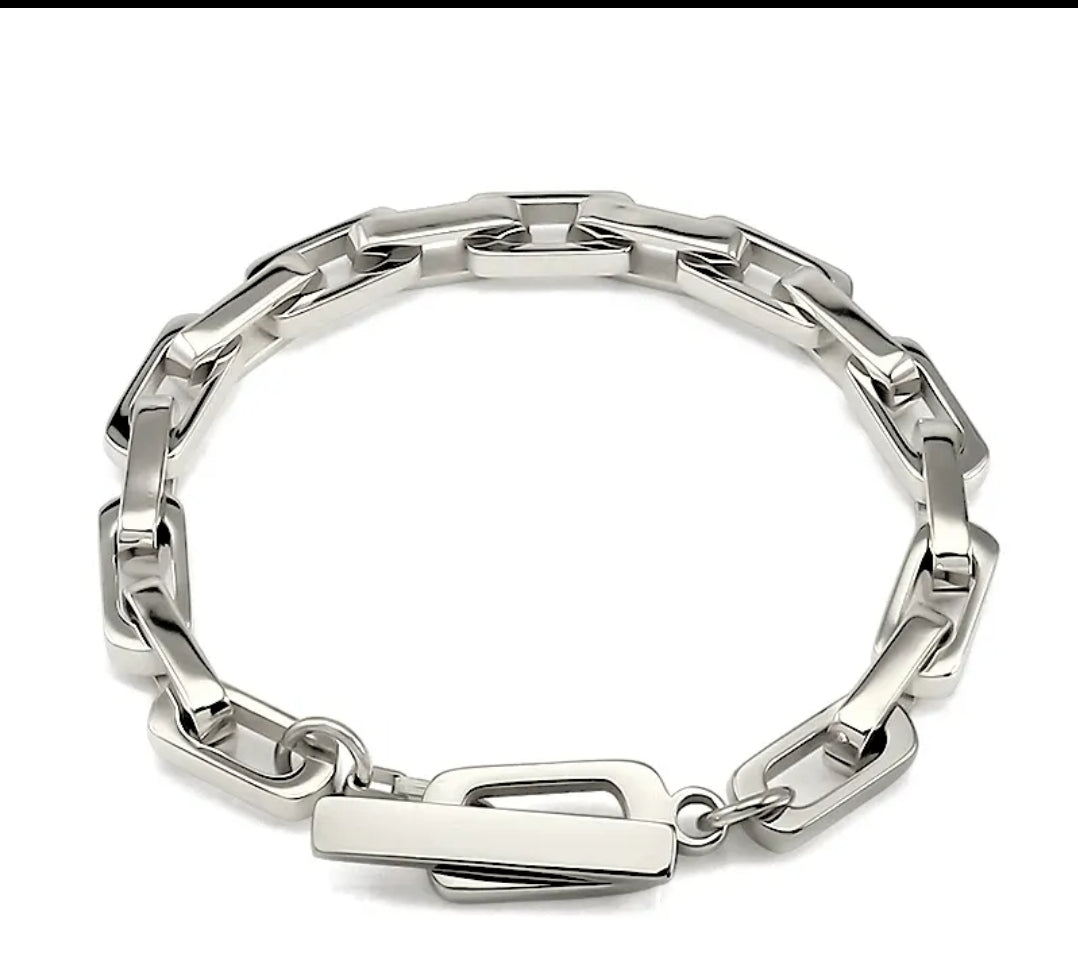 Zirconmania's unisex rectangular link bracelet features a sleek, modern chain design with a polished finish on a white backdrop.