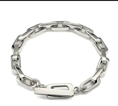 Zirconmania's unisex rectangular link bracelet features a sleek, modern chain design with a polished finish on a white backdrop.