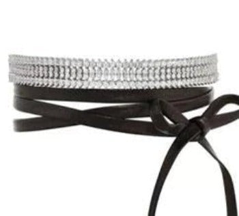 Inspired by the DiamondVeneer Fashion Zirconite Cubic Zirconia Choker Necklace, this black leather belt features sparkling rhinestones and a decorative side bow for added elegance.