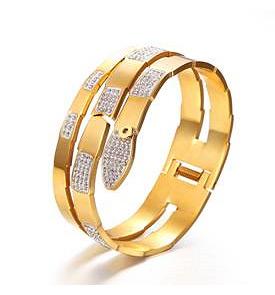 The DiamondVeneer Fashion Zirconite Jeweled Wide Snake Hinged Bangle (677B100) features a polished, modern design with sparkling zirconite crystals for a bold, elegant statement.