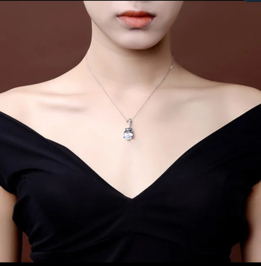 Blue topaz-color cubic zirconia pendant by Zirconite, worn on model, 851P351