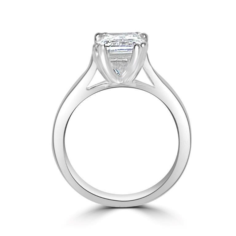 The DiamondVeneer Fashion Cushion Diamond Veneer Cubic Zirconia 14K Gold Ring (635R004K) features a large rectangular center stone in a four-prong setting, shown from the side to showcase its elegant band and design.