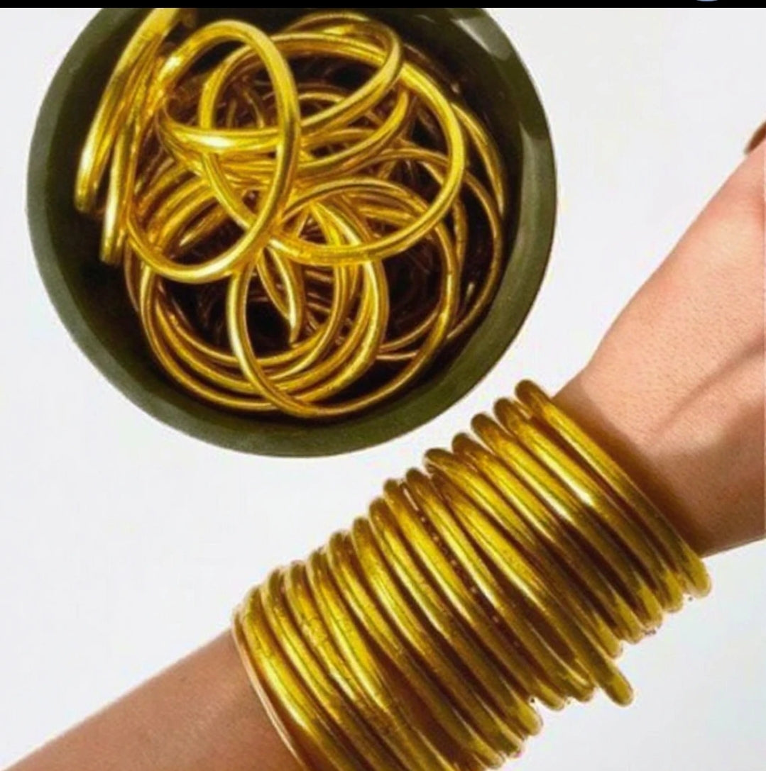 Gold silicone Buddhist temple bangle bracelet, worn on model, 859B100G