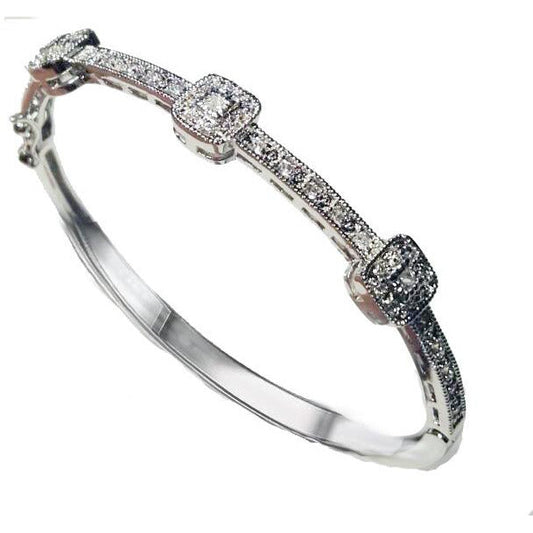 The DiamondVeneer Fashion Hinged Zirconite Cubic Zirconia 3-square Stations Rhodium Bangle Bracelet.698B004 features sparkling cubic zirconia clusters on a sleek rhodium band, showcased on a white background.