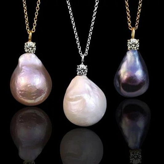 Three DiamondVeneer Fashion Diamond Veneer Cubic Zirconia genuine Baroque Pearl Pendant Necklaces (635N30P) in pink, white, and dark purple, each on gold or sterling silver chains, are shown against a black background.