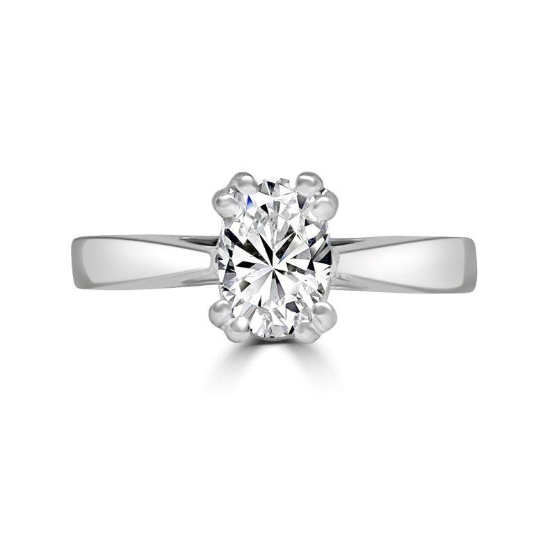 The Radiant Solitaire Diamond Veneer Cubic Zirconia 14K Gold Ring by DiamondVeneer Fashion features a round brilliant-cut CZ set in six prongs, shown on a white background for a timeless, elegant look. Model: 635R05K.