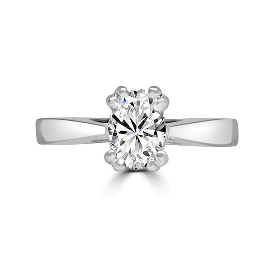 The Radiant Solitaire Diamond Veneer Cubic Zirconia 14K Gold Ring by DiamondVeneer Fashion features a round brilliant-cut CZ set in six prongs, shown on a white background for a timeless, elegant look. Model: 635R05K.