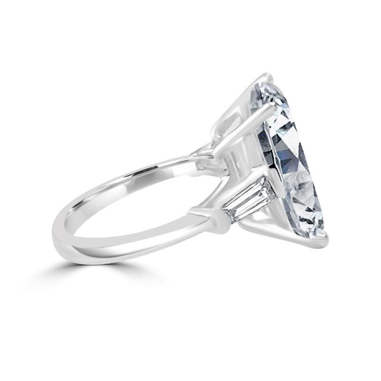 Emerald-cut cubic zirconia three-stone ring - close-up sparkle